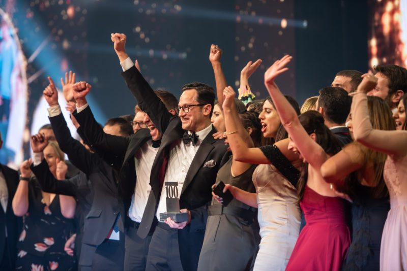 Group of people receiving award at award show